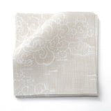 Fabric swatches in a painterly cloud pattern in white on a beige watercolor field.