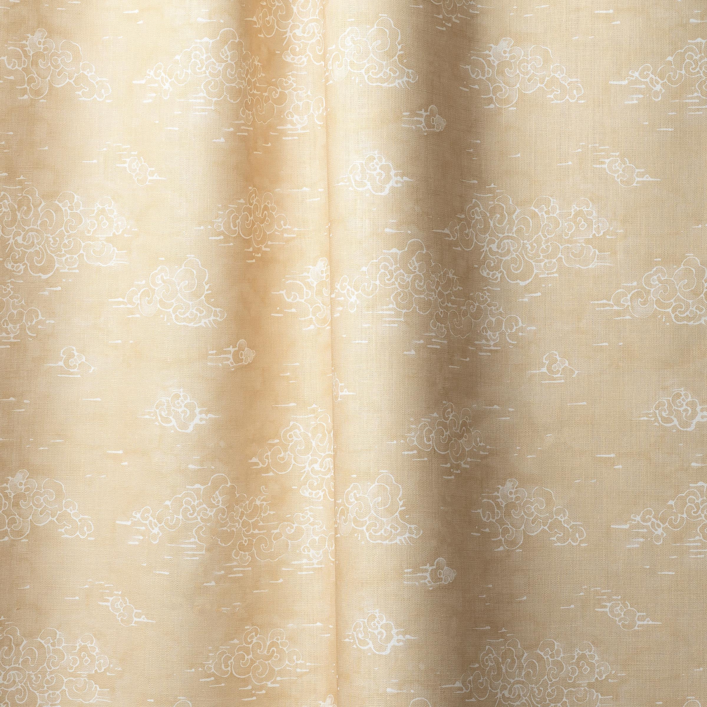 Draped fabric a painterly cloud pattern in white on a pastel yellow watercolor field.