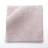 Fabric swatches in a painterly cloud pattern in white on a pastel pink watercolor field.