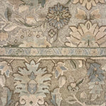 Close-up of a patterned rug with floral and geometric designs.