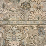 Close-up of a patterned rug with floral and geometric designs.