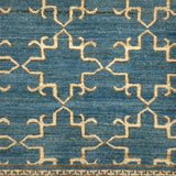 Close-up of a blue and beige ornate trellis patterned rug
