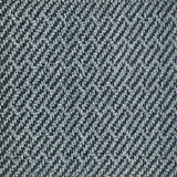 A close-up of a woven rug sample with a diagonal twill pattern in dark navy blue and light gray.