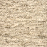 Close up of a rug in a sumak weave in cream