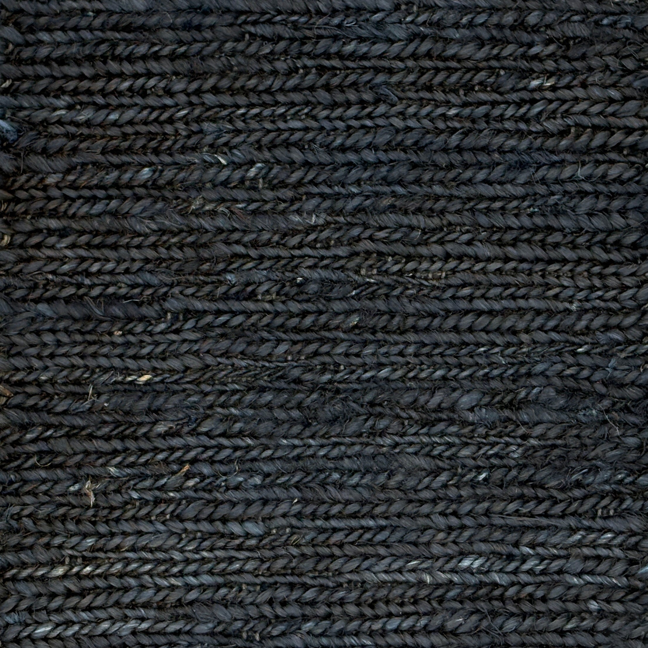Close up of a rug in a sumak weave in navy blue.