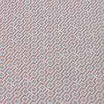 Detail of a wallpaper panel in a geometric grid print in shades of pink and gray.