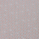 Detail of a wallpaper panel in a geometric grid print in shades of pink and gray.