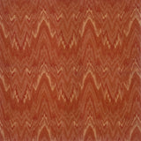 Handknotted rug with wavy lines in shades of red and orange.