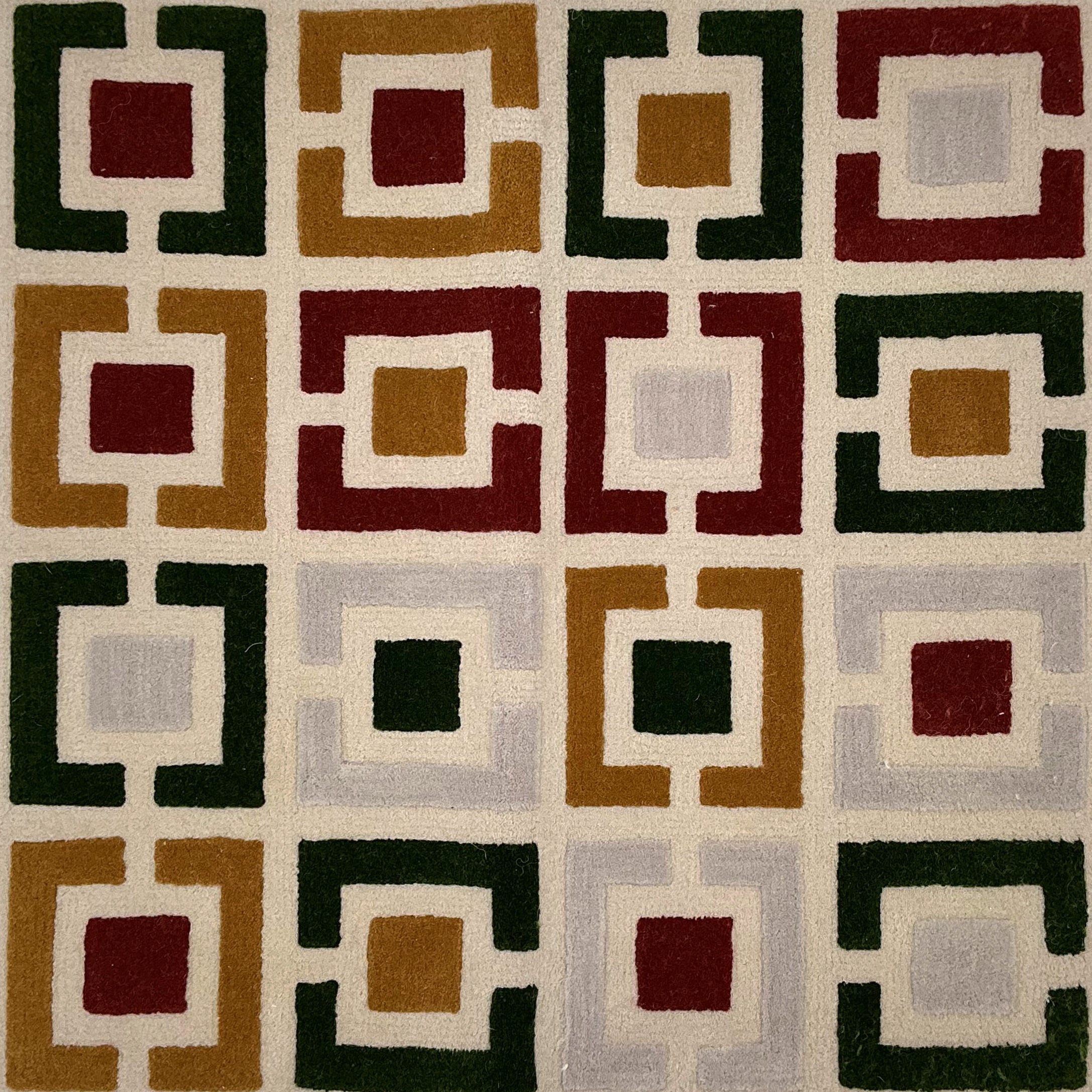 Geometric patterned rug with squares in various colors on a beige background