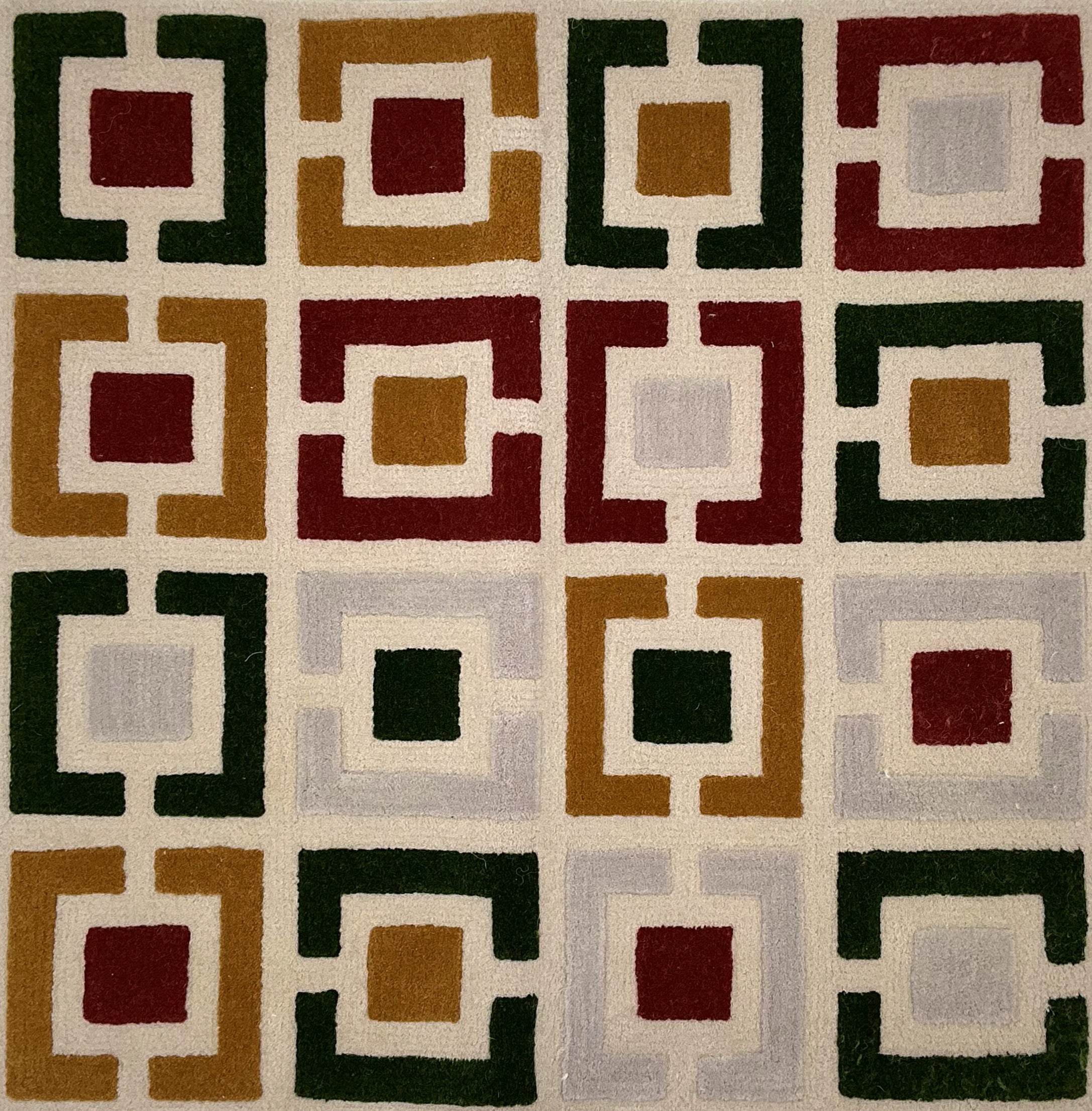 Geometric patterned rug with squares in various colors on a beige background