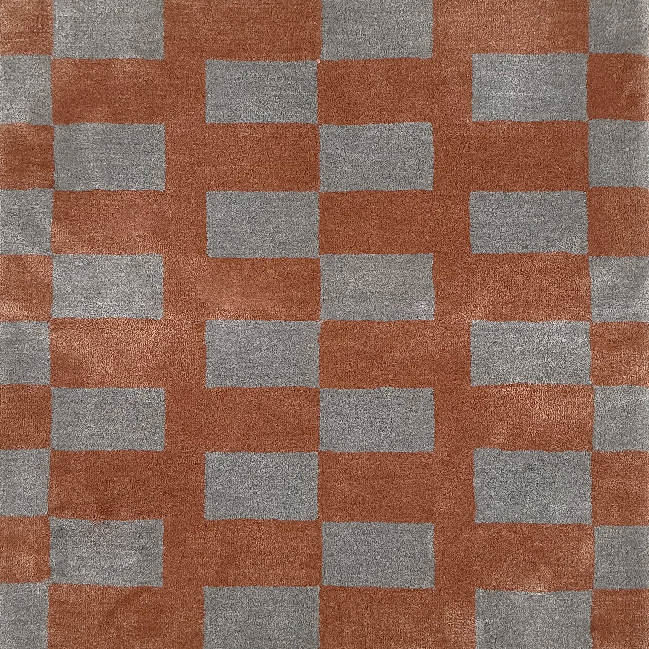 Checkered pattern with alternating coral and gray squares
