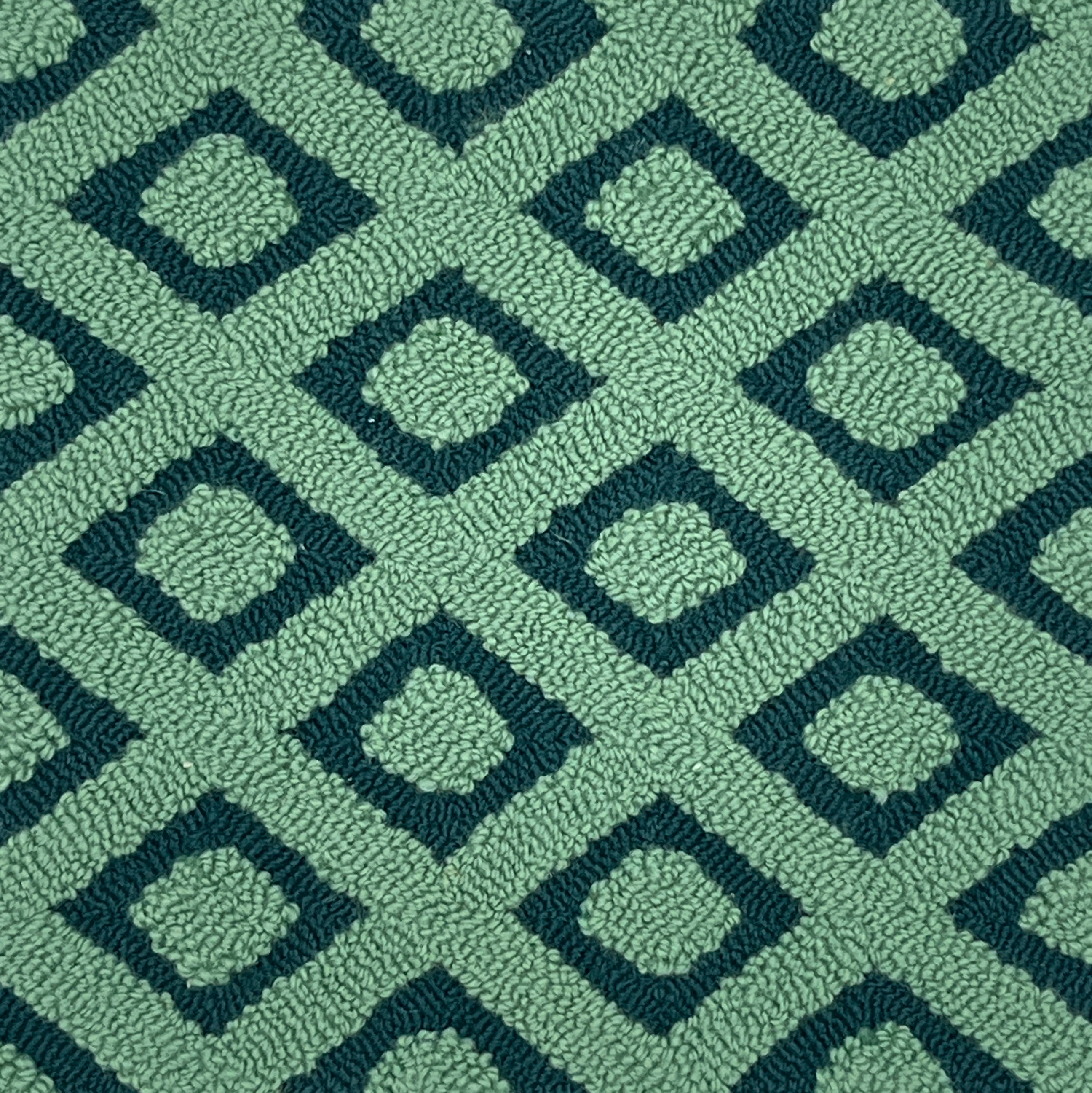 Patterned green rug with geometric design