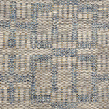 Handwoven rug detail in a contemporary design in blue and grey