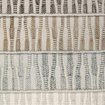 Stack of broadloom carpet samples in a flatwoven wavy stripes. 