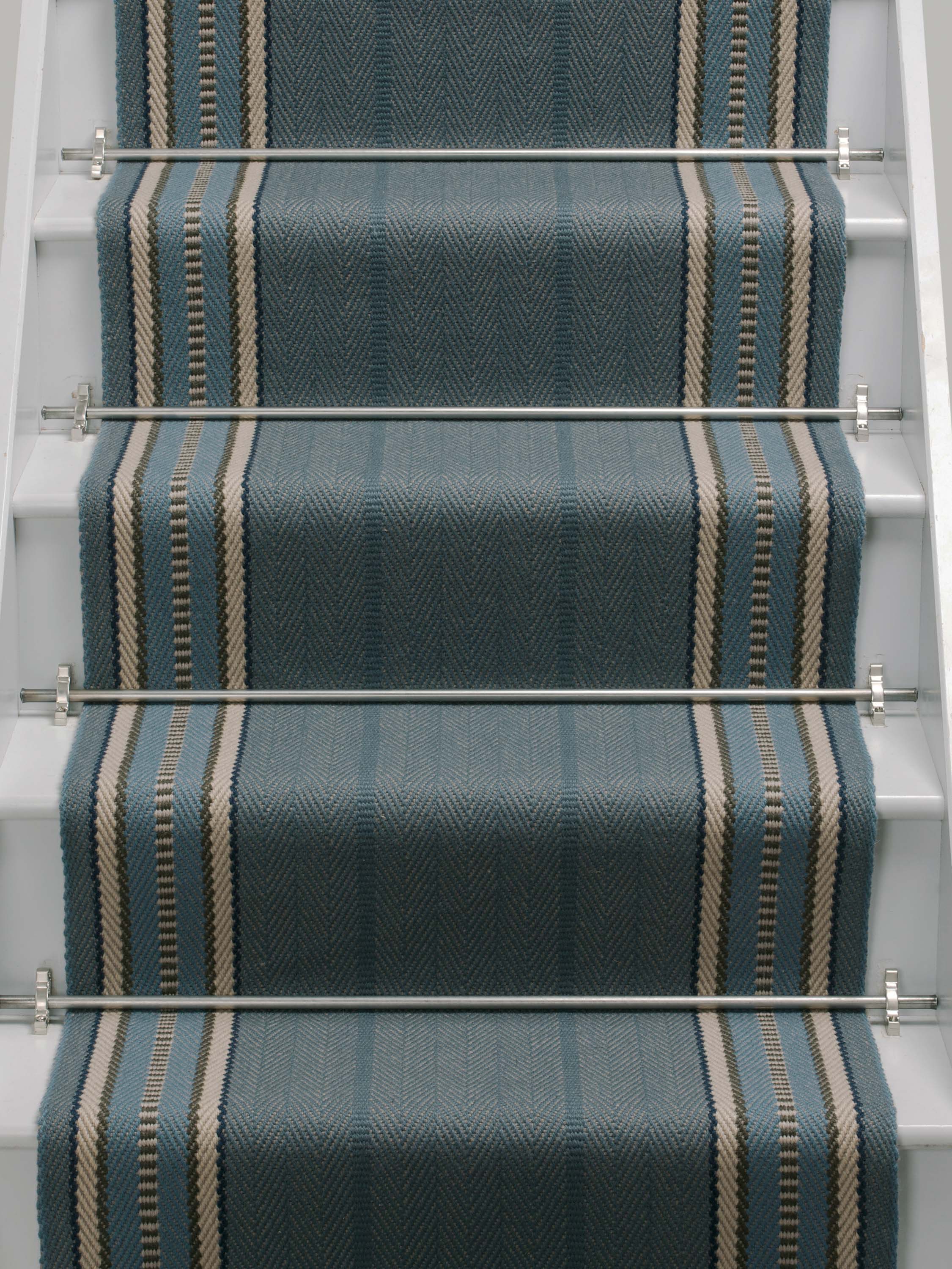 Striped flatweave runner in blue on white staircase