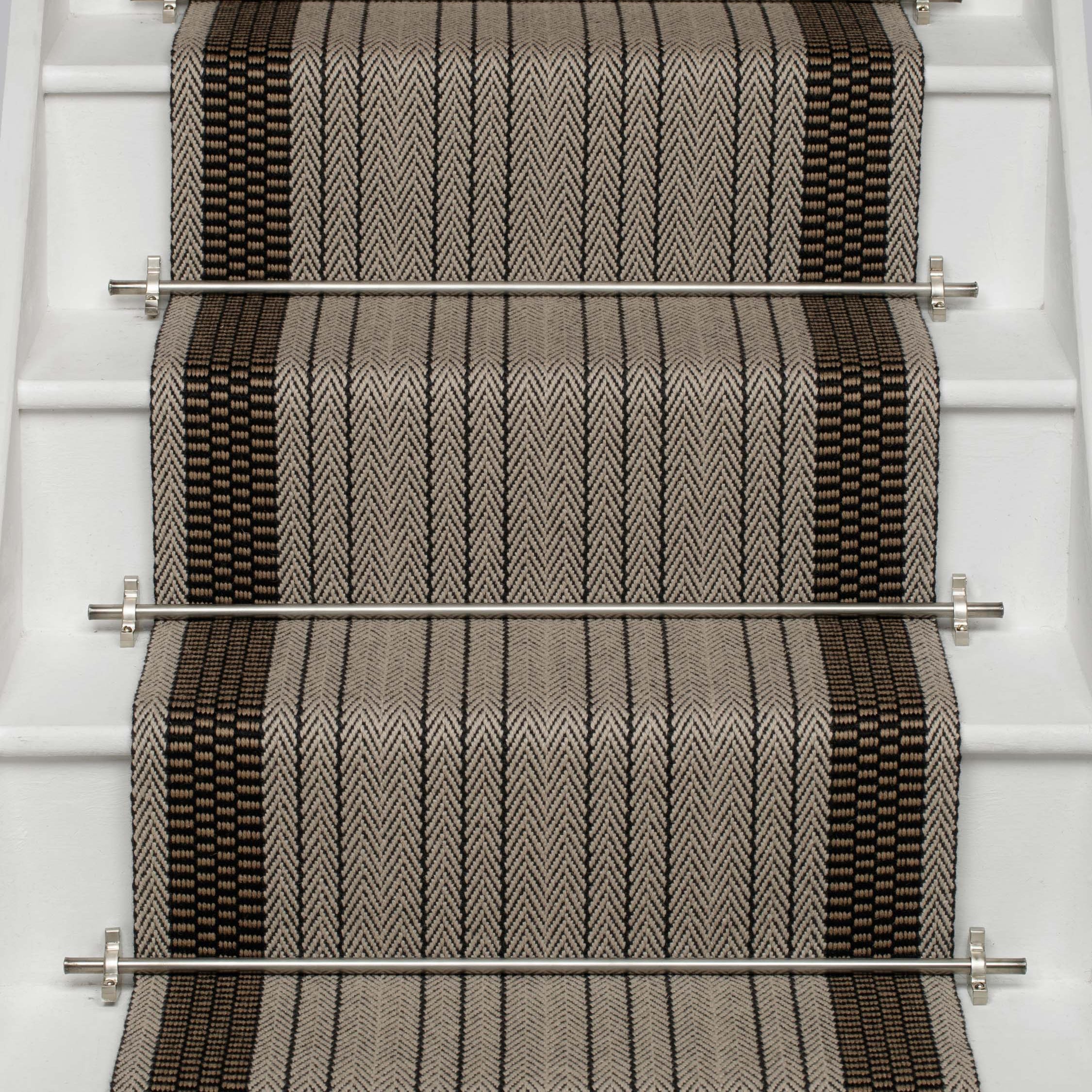 Striped flatweave runner in grey black on white staircase