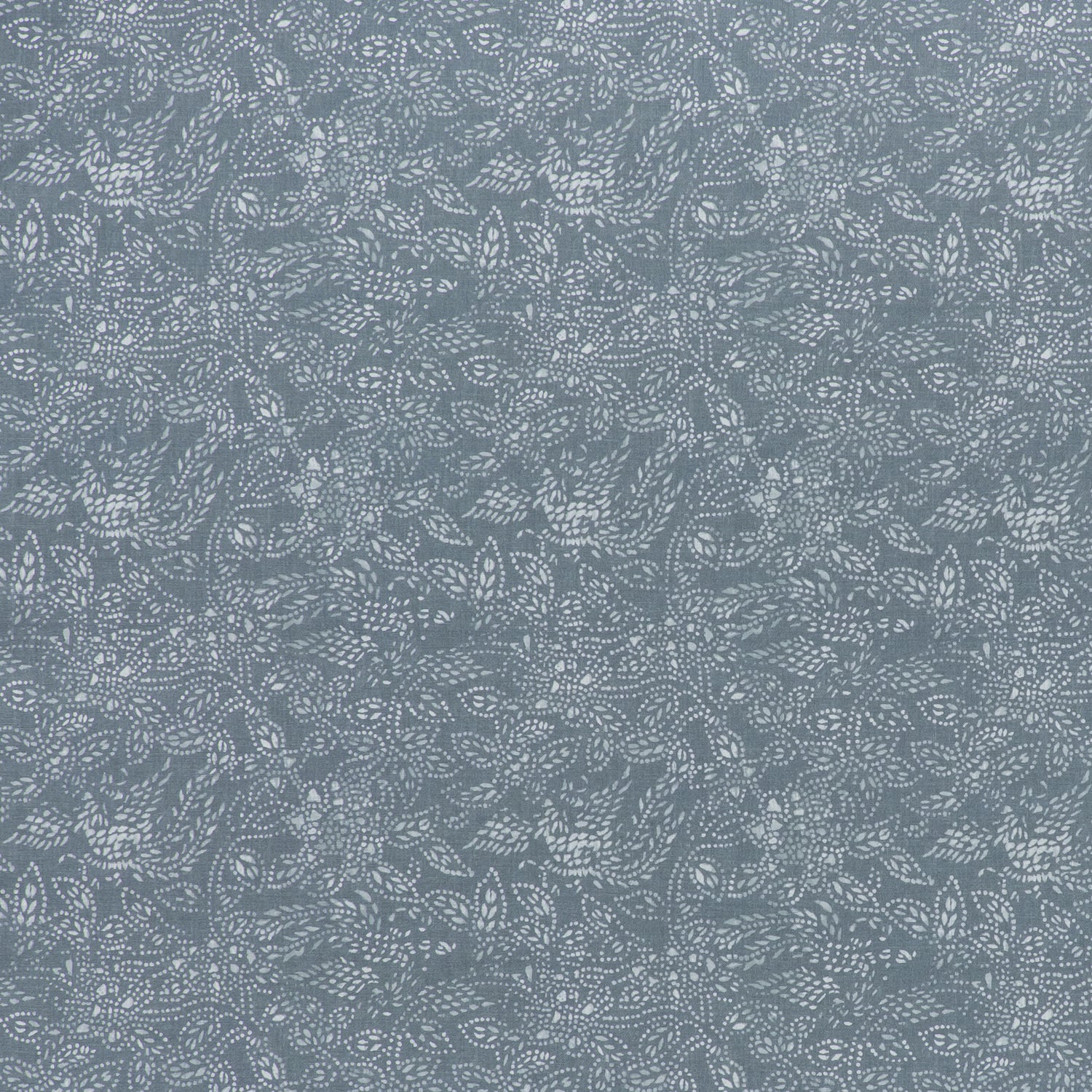 printed linen fabric in a dotted leaf pattern in white on a dusty blue field.