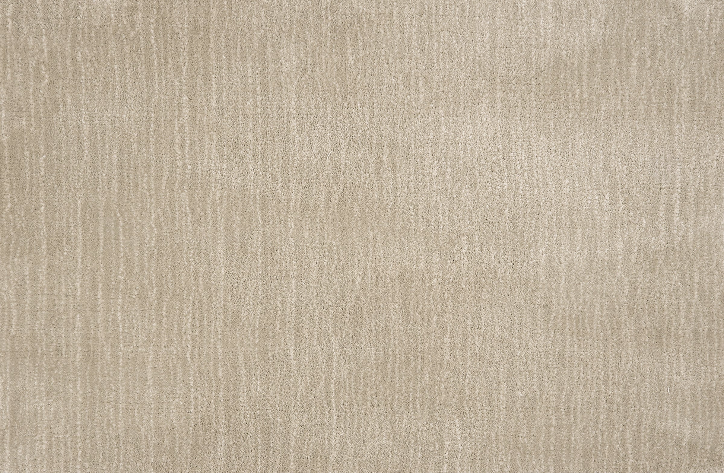 Broadloom carpet in a cut pile strié design in cool greige.  