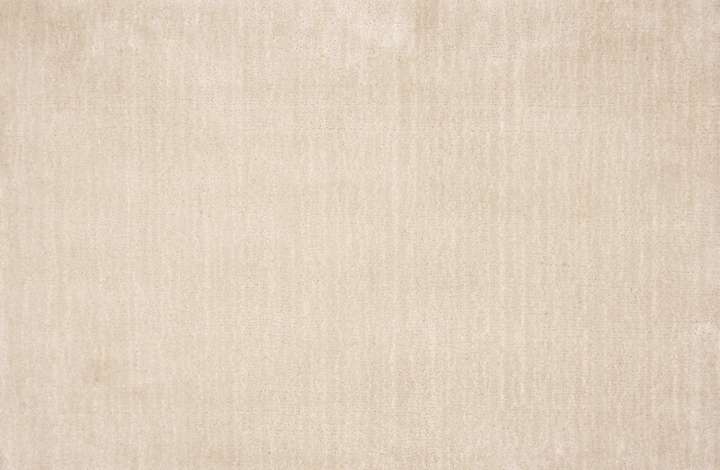 Broadloom carpet in a cut pile strié design in cream