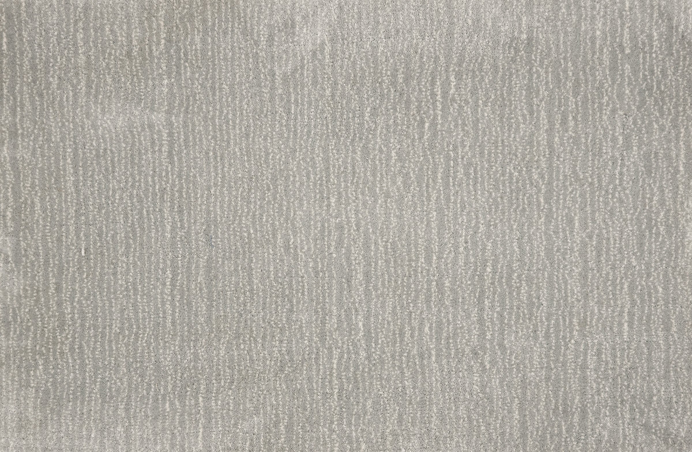 Broadloom carpet in a cut pile strié design in grey.