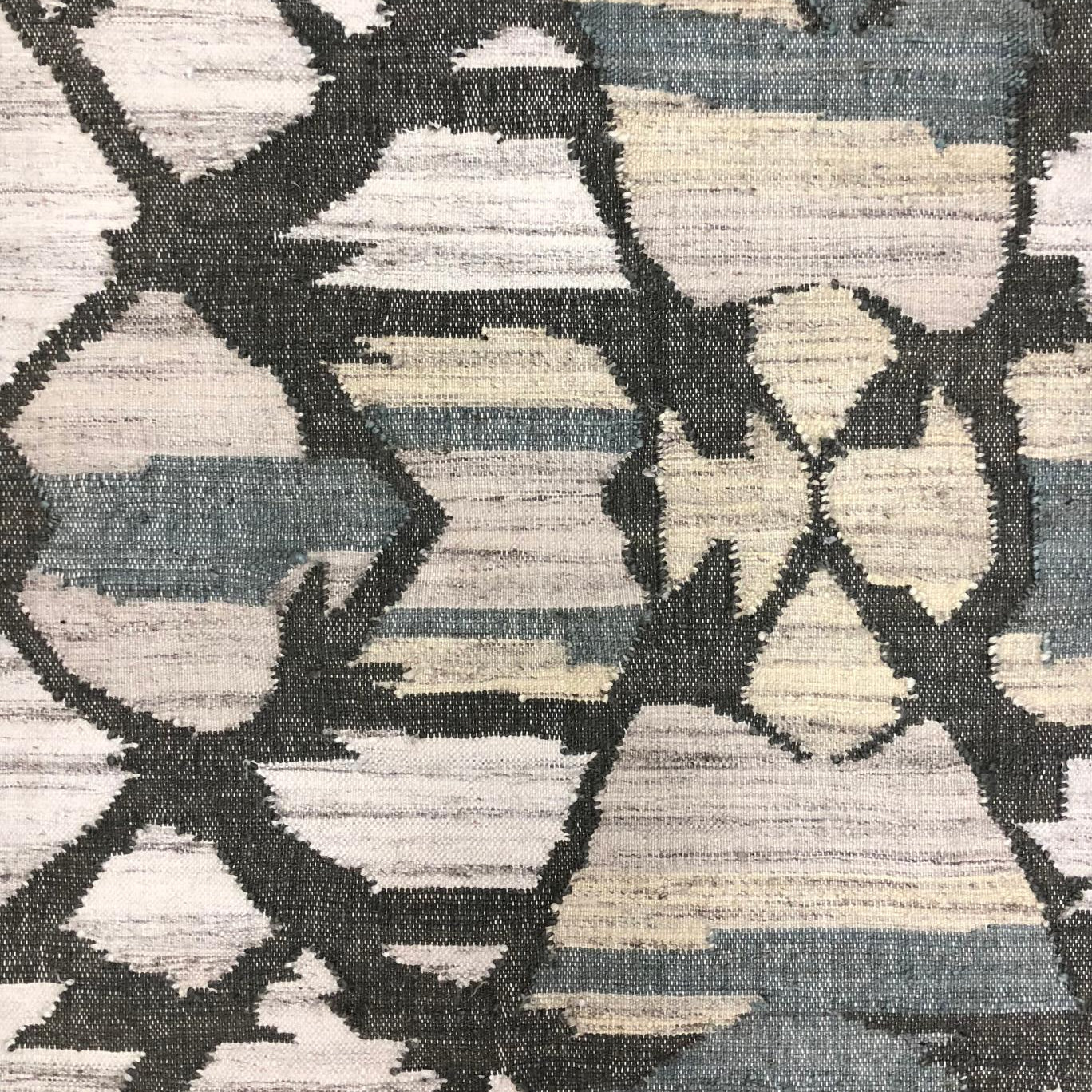 Geometric patterned rug with brown and beige colors