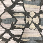 Geometric patterned rug with brown and beige colors