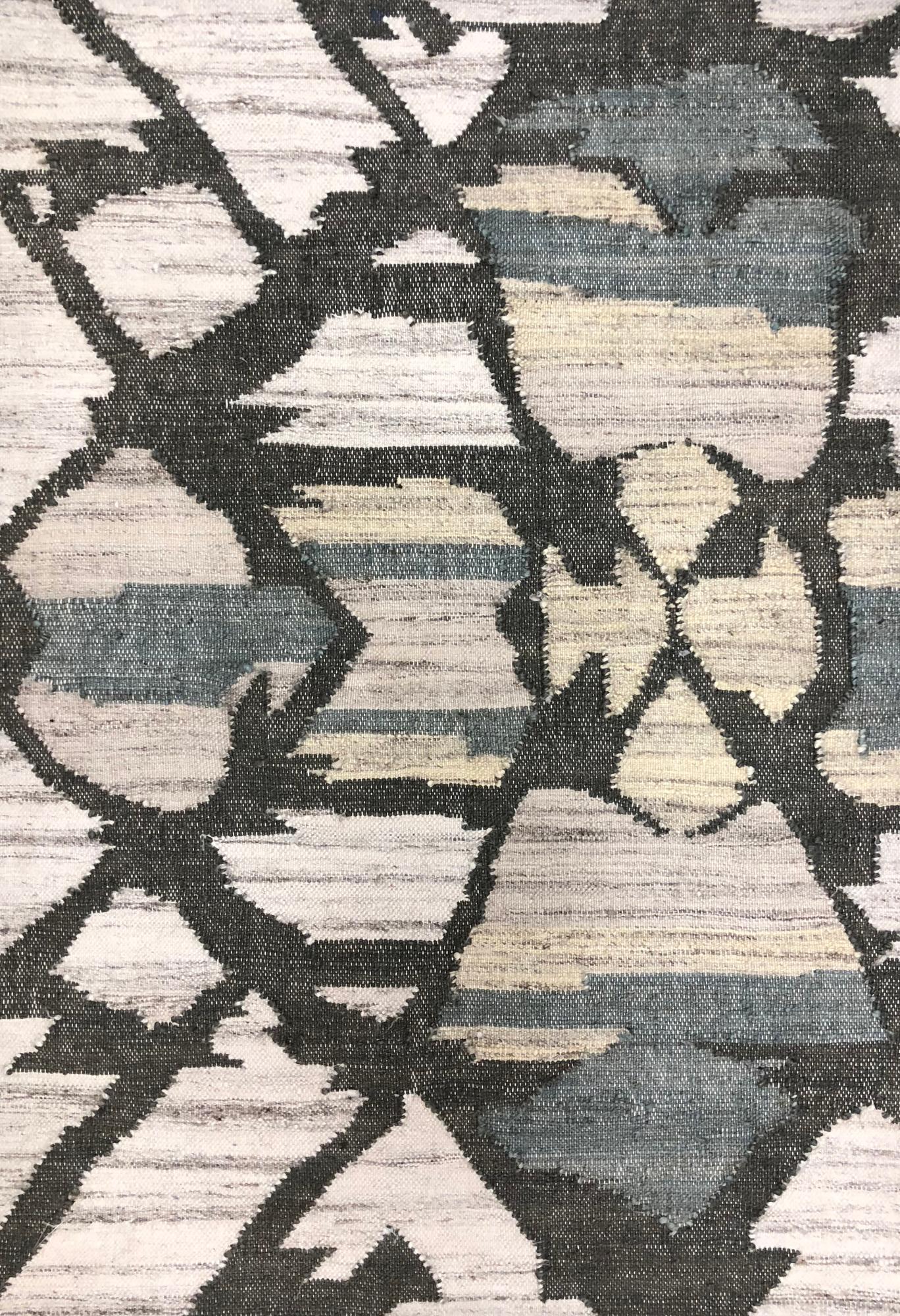 Geometric patterned rug with brown and beige colors