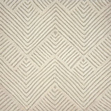 An ivory rug with a repeating raised chevron pattern on an ivory ground.
