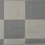 Handwoven rug in a large scale grey and ivory checkerboard pattern. 