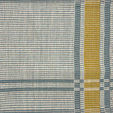 Handwoven rug in a large scale plaid in shades of cream, teal and yellow.
