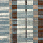 Handwoven rug in a large scale plaid in shades of teal, brown, tan, cream and black. 