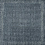 Handknotted rug sample with a tonal steel blue gridded motif.