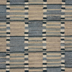 Flatweave carpet with broken stripe design in shades of blue. 