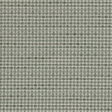 Detail of a woven outdoor fabric in a subtle check design in green. 