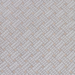 Close up of embroidered fabric with a basketweave design in cream on a beige field. 
