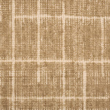 Textured carpet with a checkered pattern in tan and beige tones.