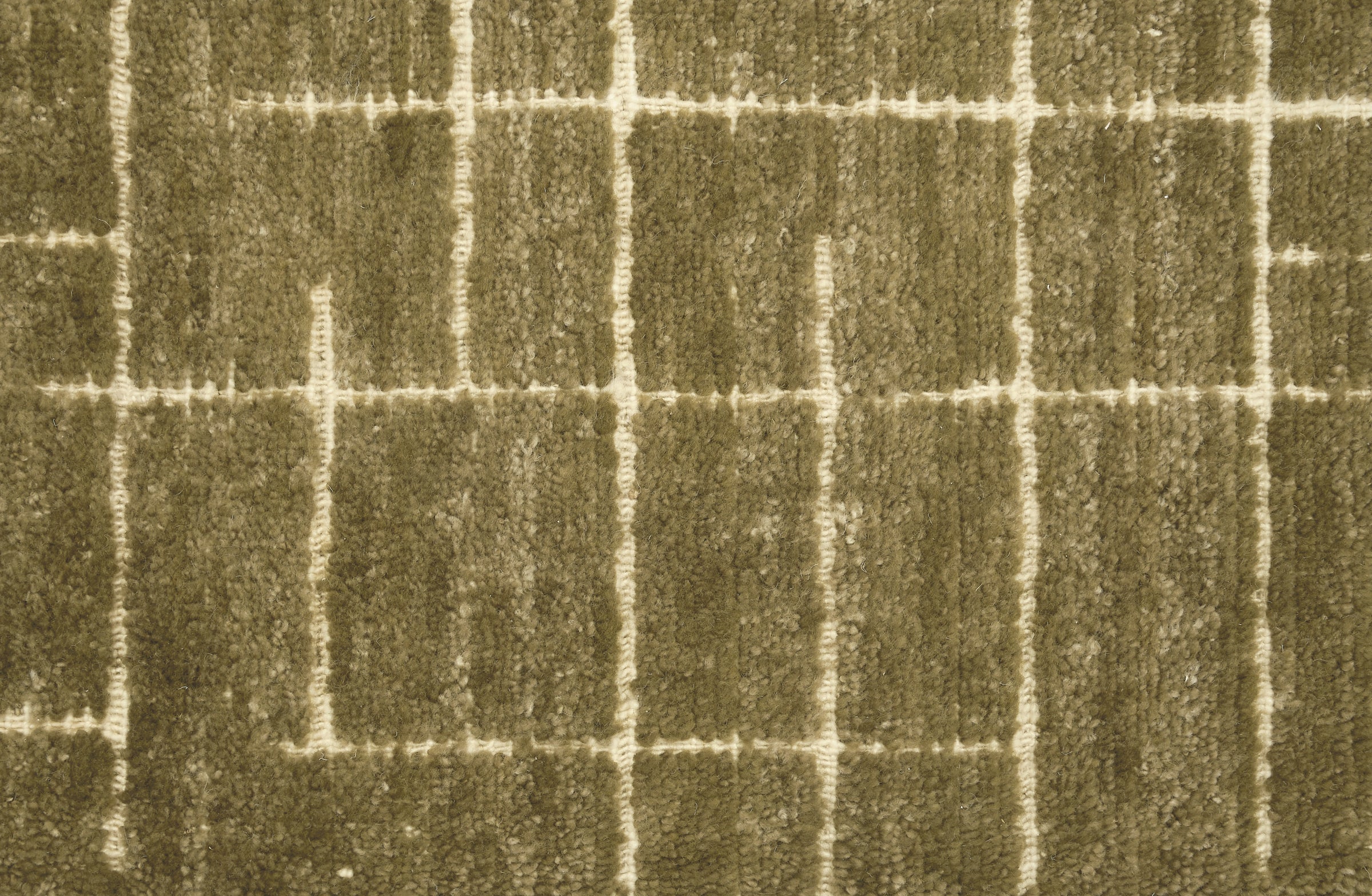 Textured carpet with a checkered pattern in olive green and beige tones.