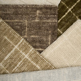 Close-up of textured carpet samples in brown, beige, and gray.