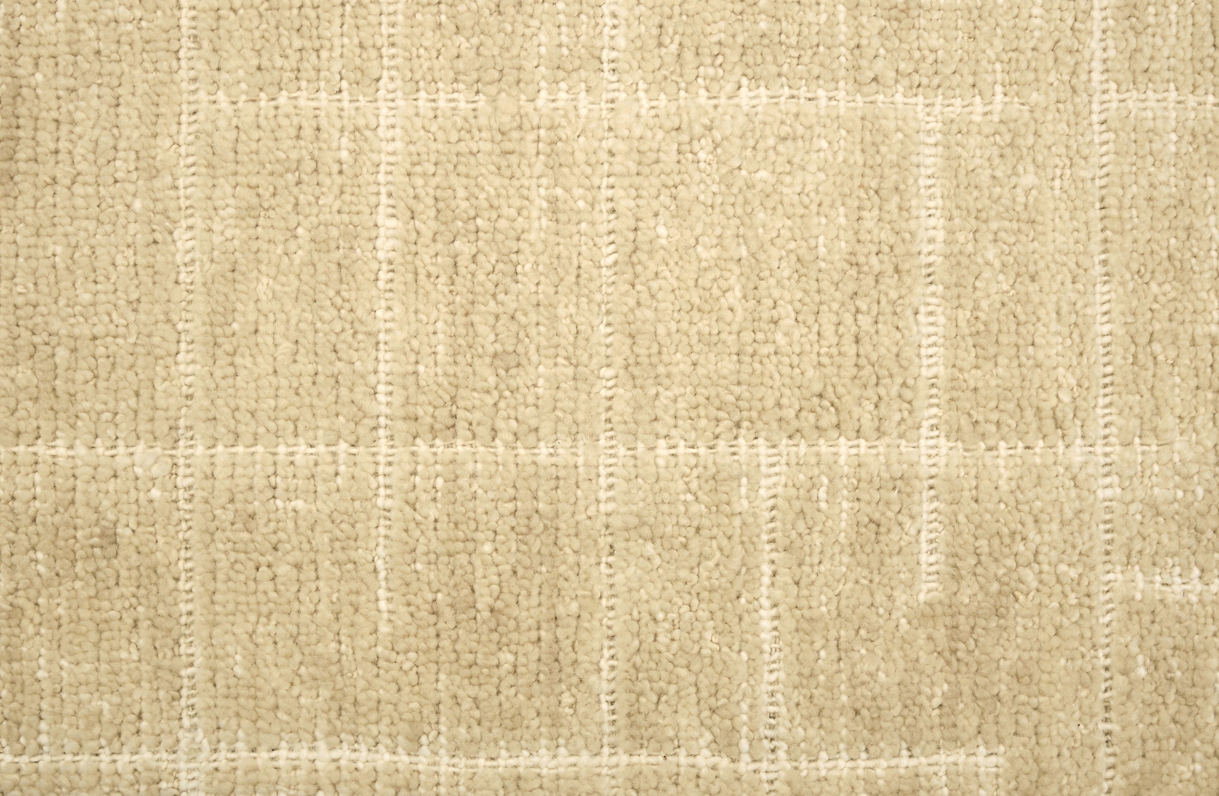 Textured carpet with a checkered pattern in beige tones.