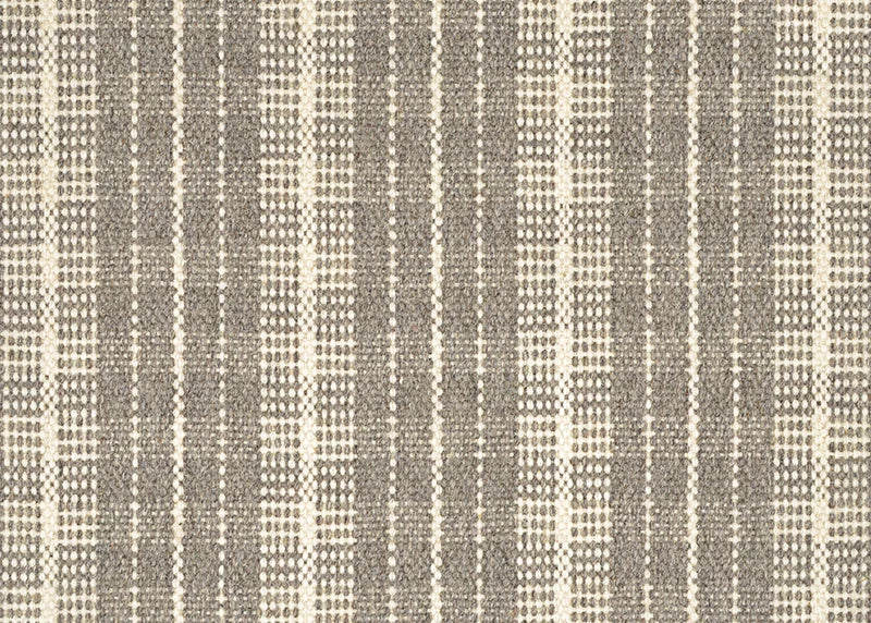 Broadloom carpet in a mixed width stripe design in ivory on a taupe field.