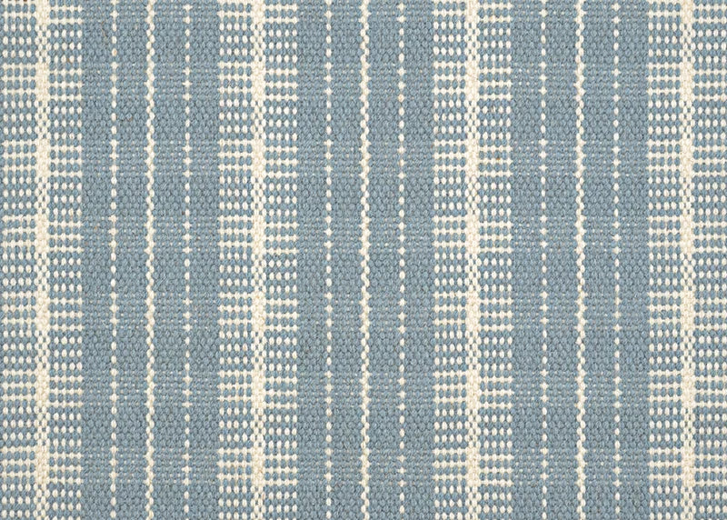 Broadloom carpet in a mixed width stripe design in ivory on a cornflower blue field. 