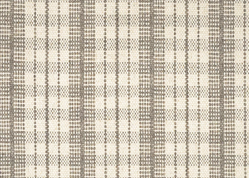 Broadloom carpet in a mixed width stripe design in ivory on a light brown field. 