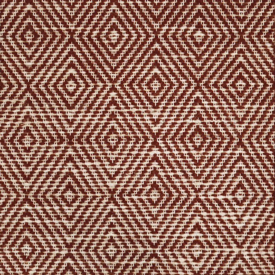 Broadloom sample in a dimensional diamond pattern in rust red and ivory.