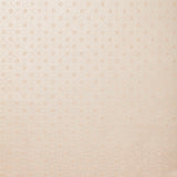 Detail of wallpaper in a honeycomb grid print in pastel pink on a cream field.