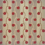 Detail of handtufted rugh with red cherry vines against neutral stripes