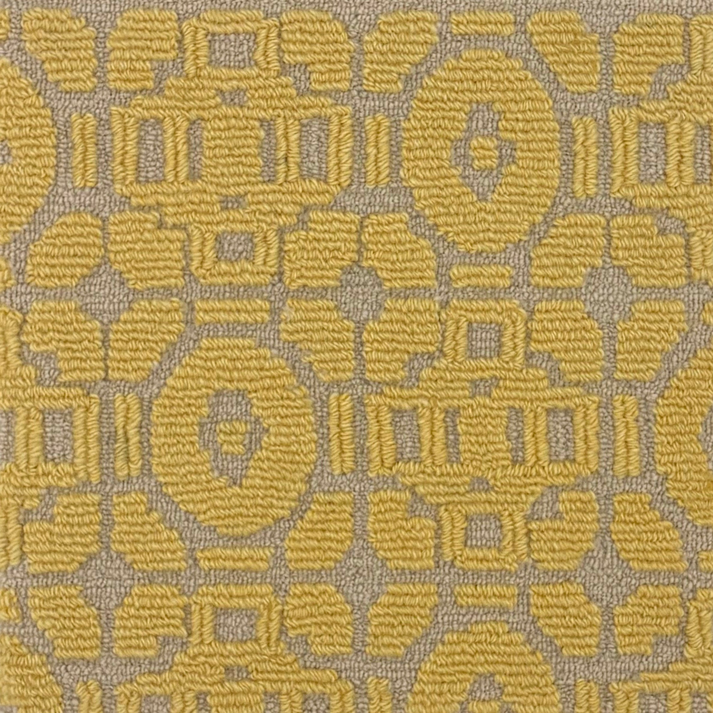 Handtufted rug sample with a raised loop geometric design in yellow on a taupe field. 