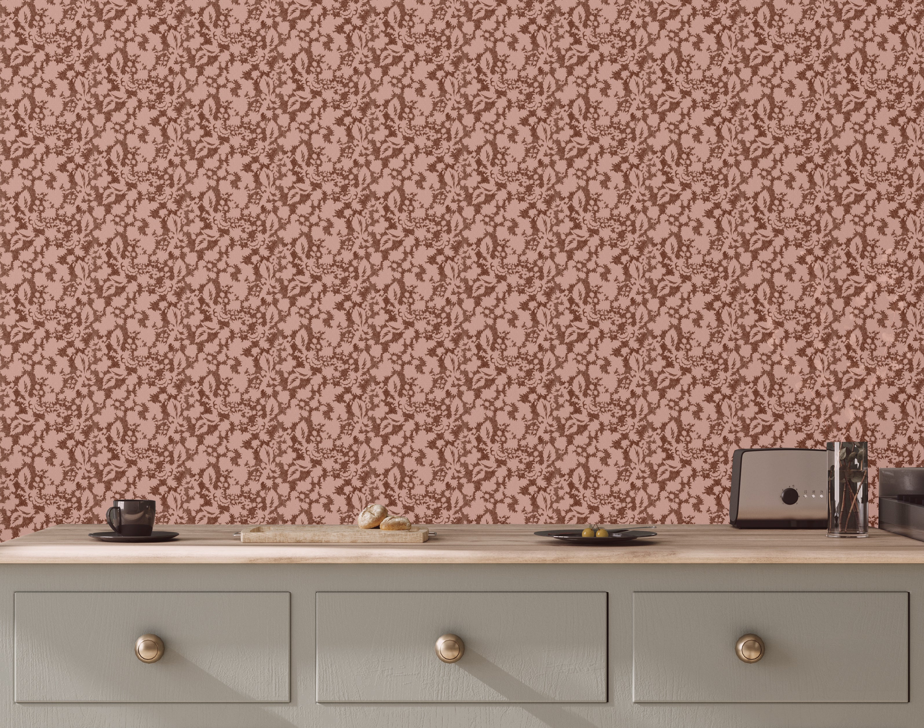 Patterned wallpaper with a pink and brown design on a wall above a wooden dresser.