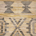 Patterned rug with geometric design in beige, brown, and gray colors