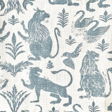 Close-up of fabric in a lion and plant print in blue-gray on a white field.