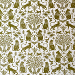 Printed fabric in a lion, mixed animal and plant pattern in olive on a white field.
